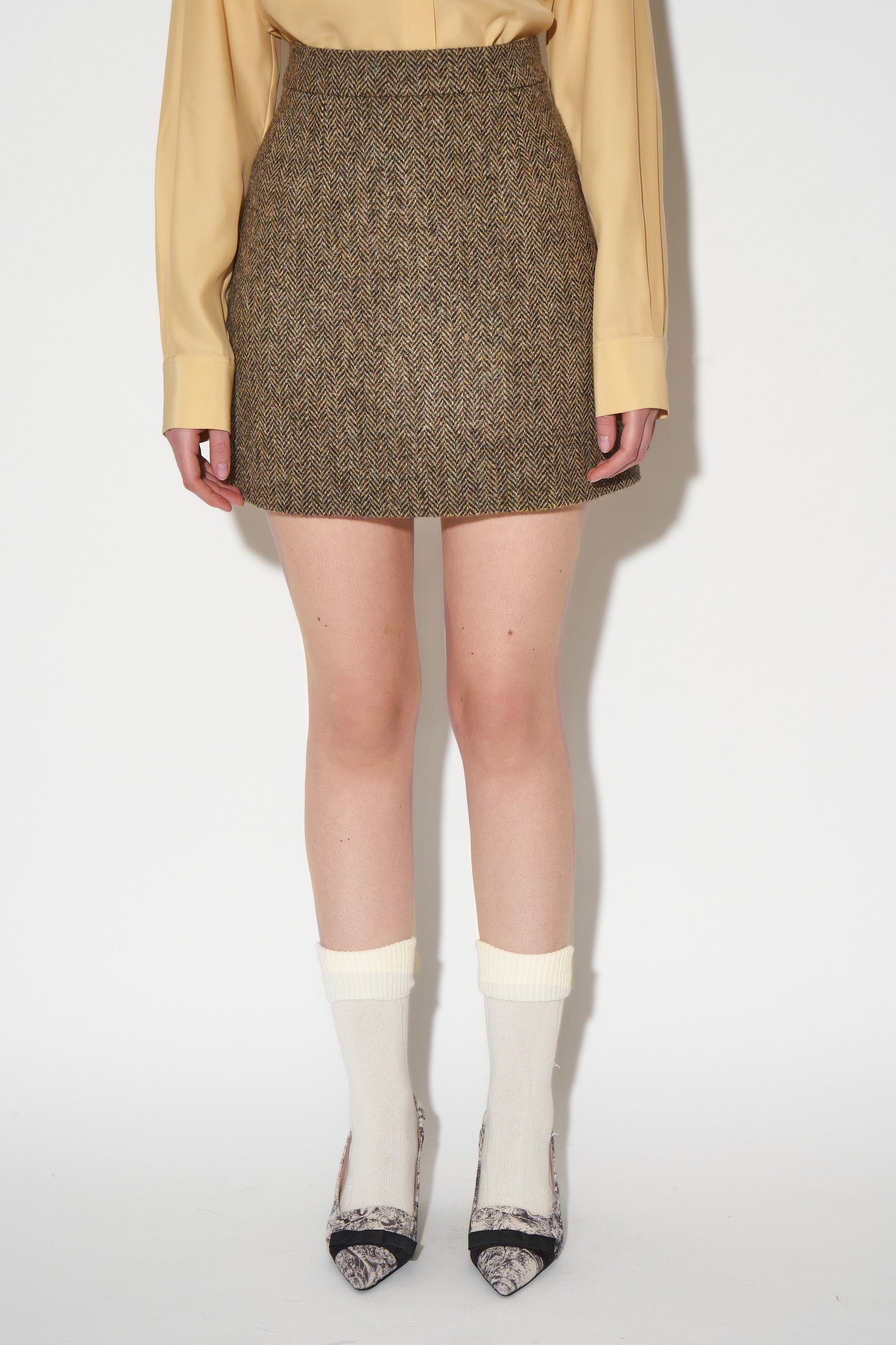 Short skirt in hand woven wool tweed