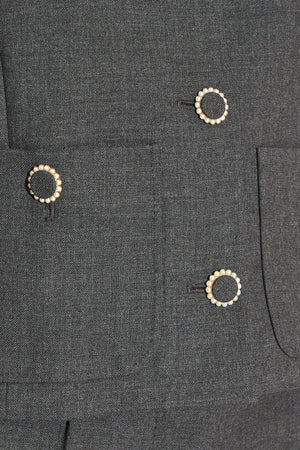 Short round-neck wool jacket with jewel buttons