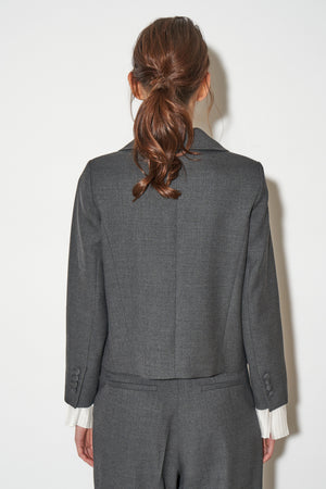 Short round-neck wool jacket with jewel buttons