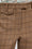 Pantalon fuselé en tweed de laine à carreaux