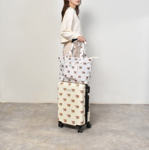 Ivory suitcase with Nounette pattern