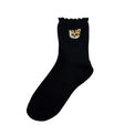 Chaussettes noires motif tête Nounette sur l'ourlet