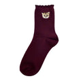 Chaussettes bordeaux motif tête Nounette sur l'ourlet
