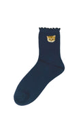 Navy socks with Nounette head pattern on the hem