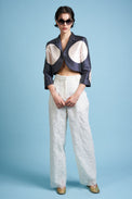 Trousers in cotton and silk organza embroidered with a floral motif