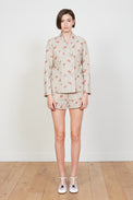 Linen shorts embroidered with floral motifs